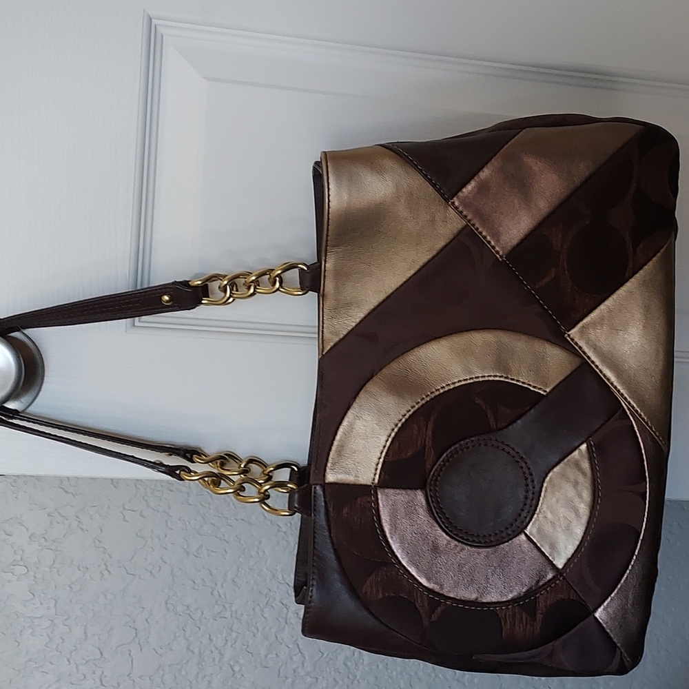 Coach bag brown and gold.